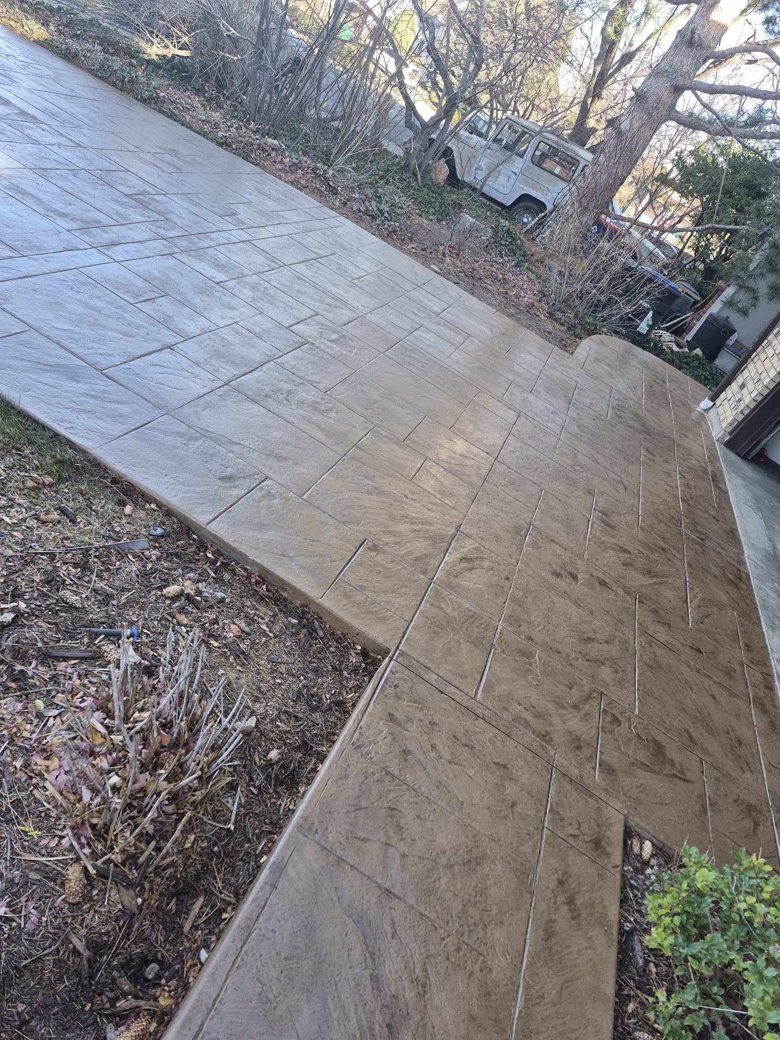 Wide stamped concrete driveway in an ashlar slate pattern