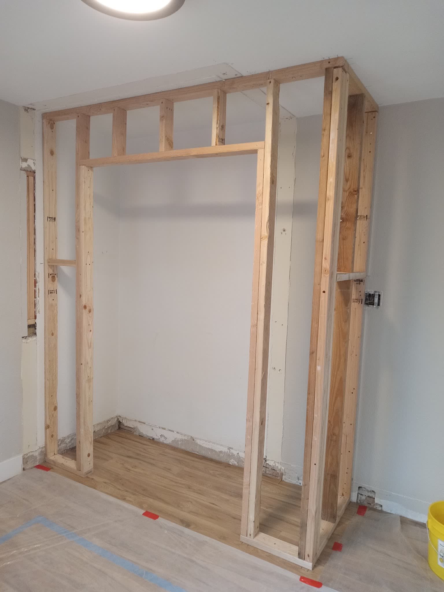A new stud opening framed into a bedroom wall